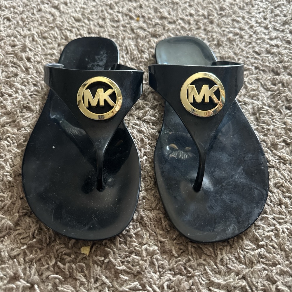 Michael Kors Black Flip Flops with Gold Emblem